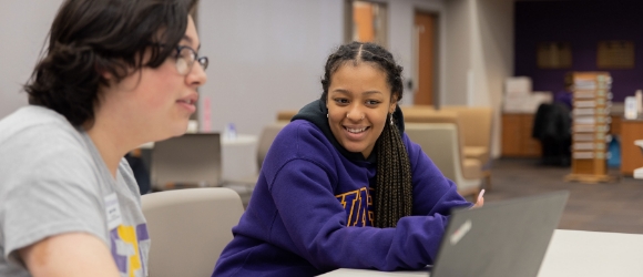 Two UMHB students studying together